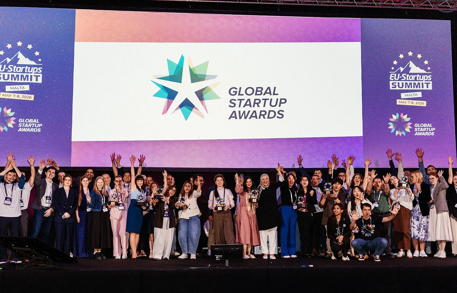 Edition 11 finalists celebrating on stage under the Global Startup Awards logo at the EU-Startups Summit in Malta